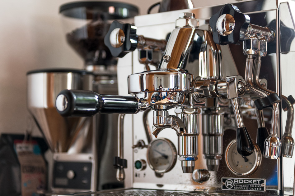 Closer photo of the espresso machine in my kitchen with the grinder in the background