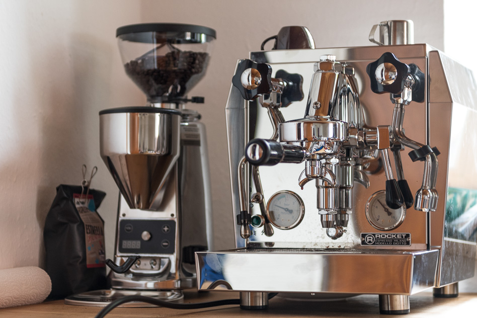 Photo of the espresso machine in my kitchen with the grinder in the background